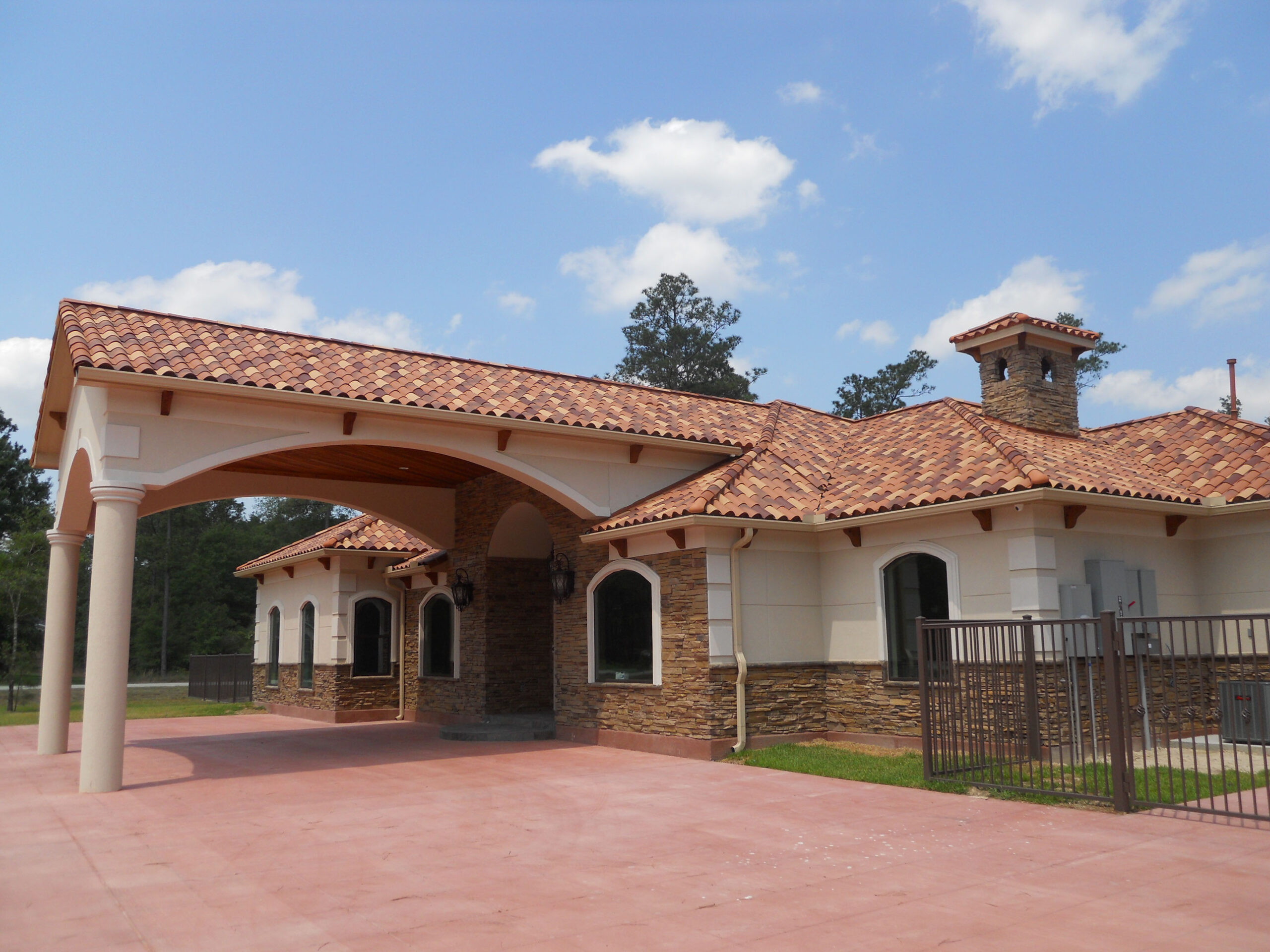 Seamless gutter installation in progress on a residential home in West Livingston, TX