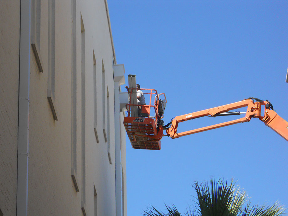 2011-10-13 1402022 Gutter technician working on a residential roof in Texas<br />