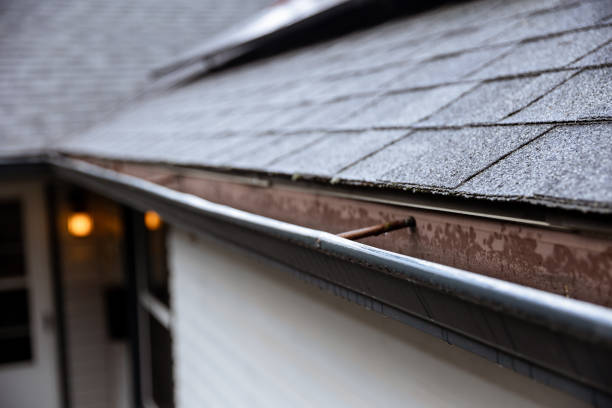 A.J.’s Seamless Gutters cleaning residential gutters in Flatonia, TX