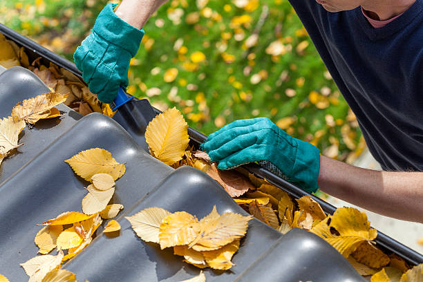 A.J.’s Seamless Gutters cleaning residential gutters in Houston, TX